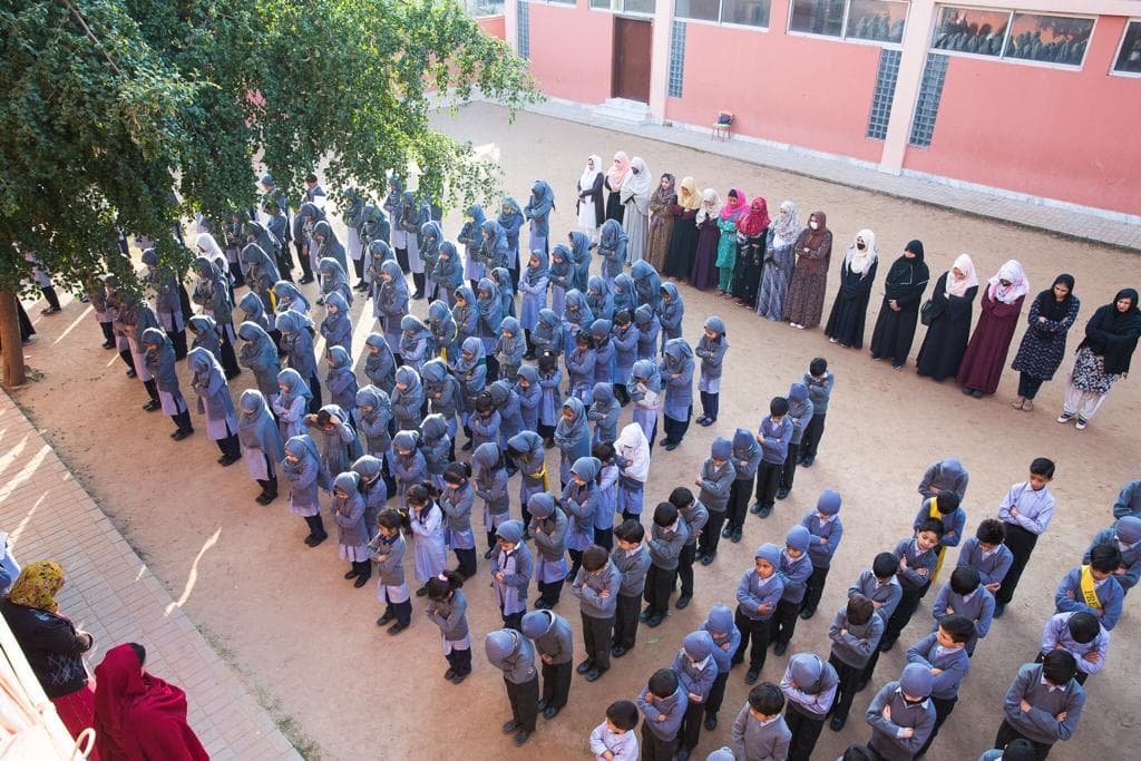 Qalam School children gathered in the courtyard